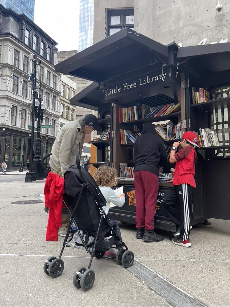 Benefits of traveling with family by picking books from Free Little Library on the Freedom Trail in Boston, MA
